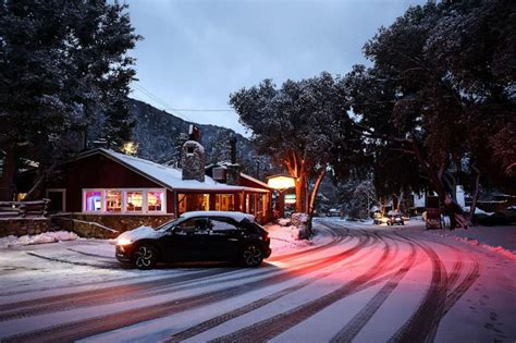 Rare snowfall in Southern California strands residents as another ...