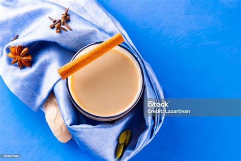 Masala Chai Tea On A Blue Napkin Traditional Indian Drink Masala Tea With Various Spices Glass