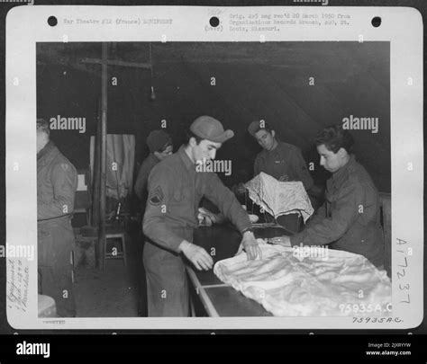 Members Of The Th Troop Carrier Group Pack Parachutes In The