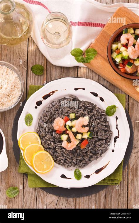 Squid ink risotto Stock Photo - Alamy