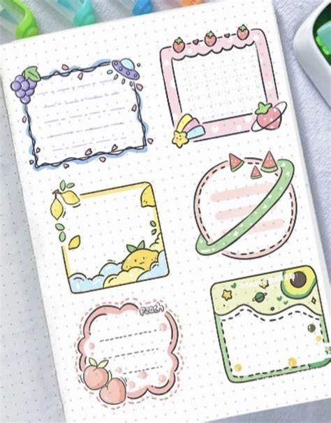 An Open Notebook With Stickers On It And Some Pens Next To It Along