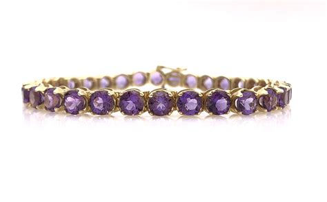 Lot 14K YELLOW GOLD 11 50CTTW AMETHYST TENNIS BRACELET