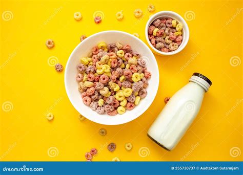 Healthy Breakfast Concept Colorful Ring Cereals In Large Bowl And Mini Bowl With Milk In Bottle