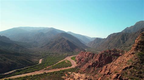 Aerial view drone flying over scenic red rocky mountains with a clear ...