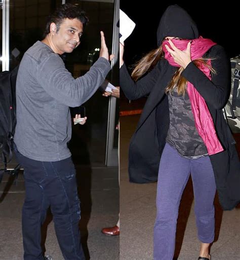 Nargis Fakhri hides her face while Uday Chopra flashes his smile at the ...