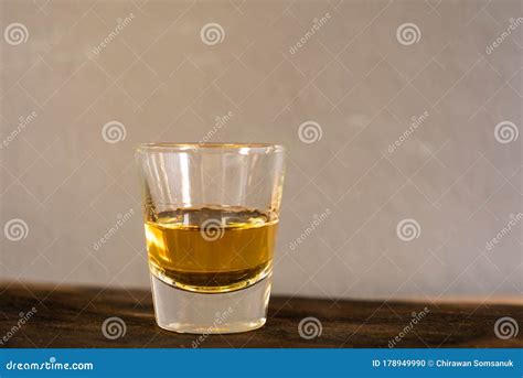 Whiskey one shot in a cup stock photo. Image of alcoholic - 178949990