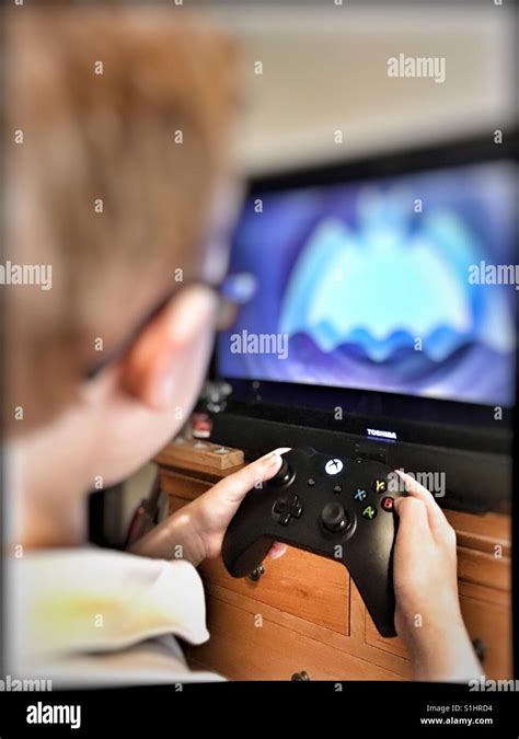 Boy playing Xbox Stock Photo - Alamy