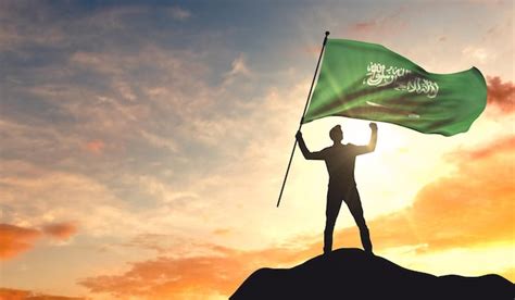 Premium Photo Saudi Arabia Flag Being Waved By A Man Celebrating