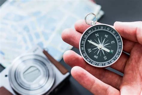 Tourist Holding Compass In Hand Stock Photo Dmitrypoch