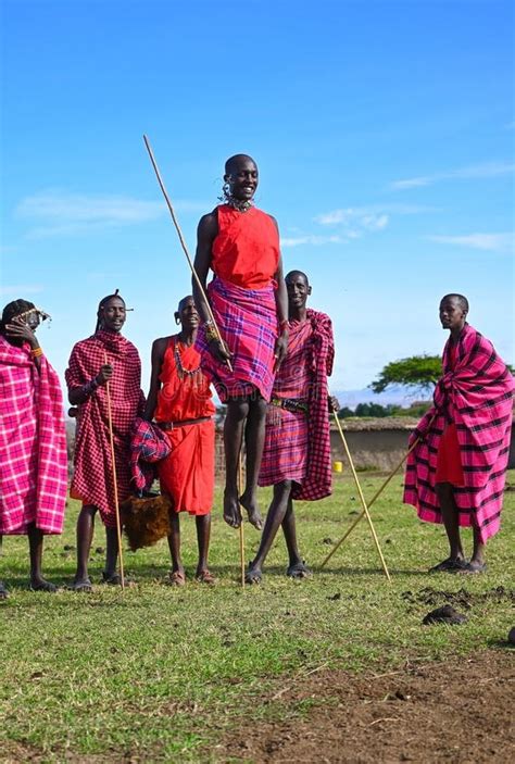 Maasai Men in Traditional Colorful Clothing Showing Traditional Maasai ...