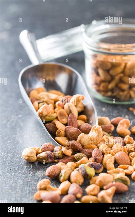 Spicy Flavoured Nuts Mix Of Nuts In Scoop Stock Photo Alamy