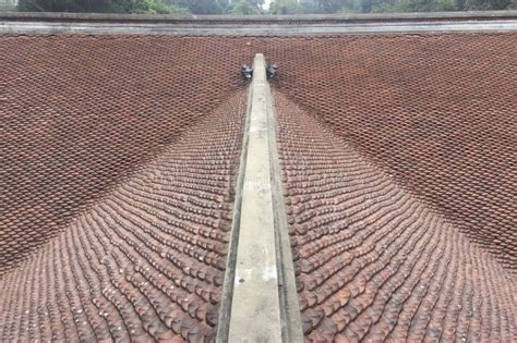 A Large, Curved Roof Made of Red Tiles in Hanoi Vietnam Stock Image ...