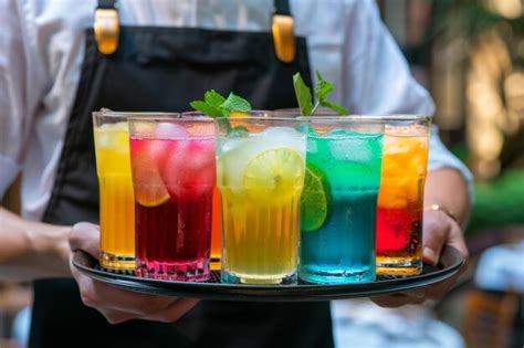 Premium Photo Waiter Holding A Tray Of Colorful Cocktails Generative Ai