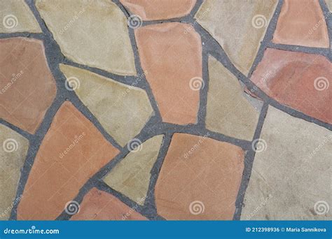 Fragment Of A Wall Made Of Chipped Stone Stone Tiles Of Various Shapes