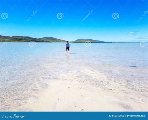 Man Walking In Clear Blue Water Stock Photo Image Of Harbour