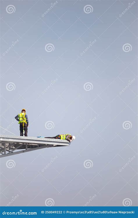 Workers Working At Height During The Construction Of A Modern Facility