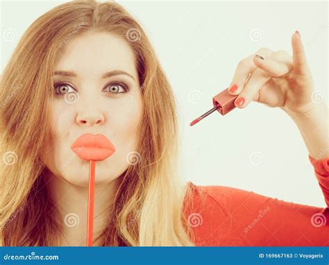 Woman Applying Lipstick Or Lip Gloss Stock Image Image Of Funny