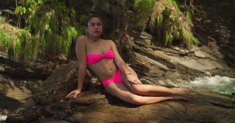 Hispanic Girl In A Pink Bikini Sits On A Stock Video Pond
