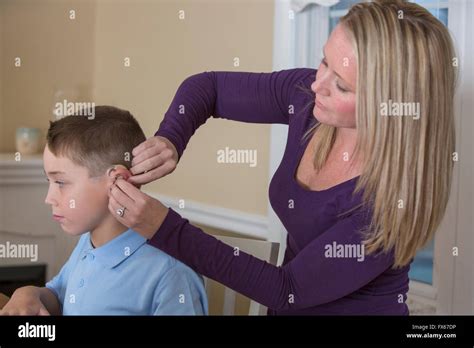 Deaf Person Hearing Aid Hi Res Stock Photography And Images Alamy