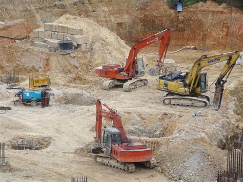 Heavy Construction Machines Doing Building Foundation Works at the ...