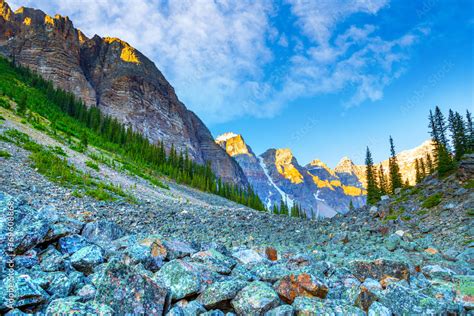 Morning Sun Lights Up The Valley Of Ten Peaks At Moraine Lake Along