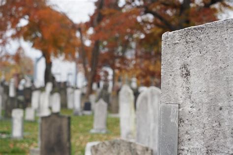 Premium Photo Closeup Of Cemetery Gravestones In Autumn