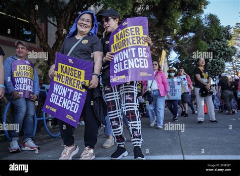 Kaiser Permanente Workers Hold Placards Expressing Their Opinion During