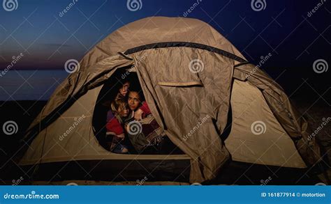 Refugee Family Sitting in Tent, Hiding from Migration Border Service on Shore Stock Photo ...