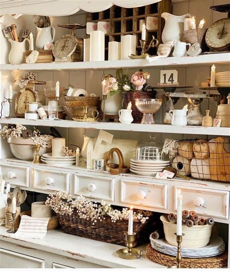 A Shelf Filled With Lots Of Different Types Of Dishes And Vases On Top