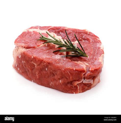 Raw Ribeye Steak Garnished With Sprig Of Rosemary Stock Photo Alamy