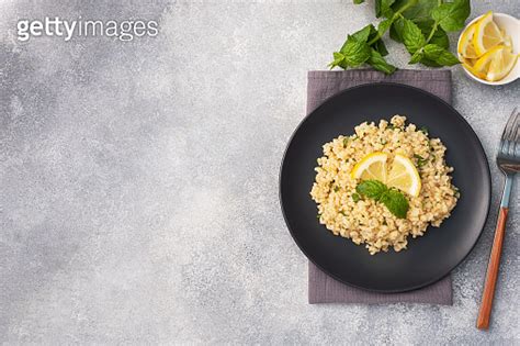 Boiled Bulgur With Fresh Lemon And Mint On A Plate A Traditional