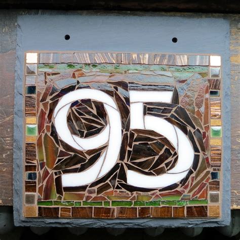 Arts And Crafts Style House Number In Chelsea Studio Font Nutmeg