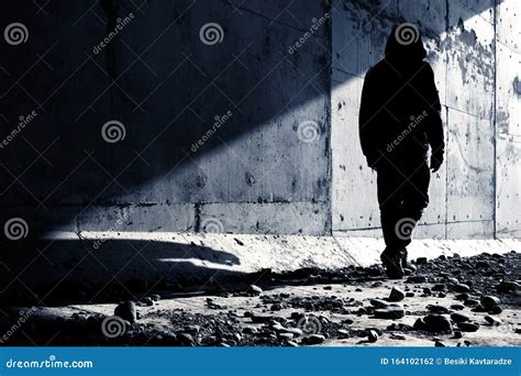 A Man Going Out of an Abandoned Tunnel Leaving a Strong Shadow Behind. Stock Photo - Image of ...