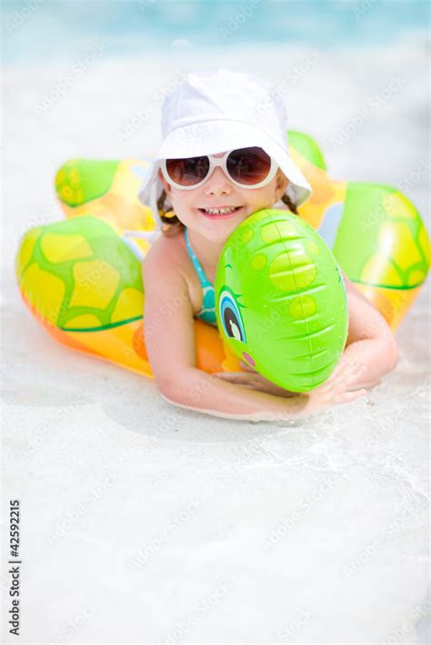 Little girl swimming at pool Stock Photo | Adobe Stock