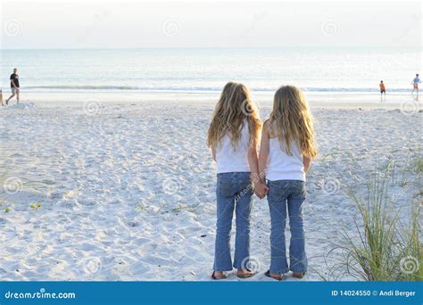 Sisters Holding Hands On The Beach Stock Photo Image 14024550