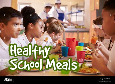 Primary School Children Eat Healthy School Meals Stock Photo Alamy