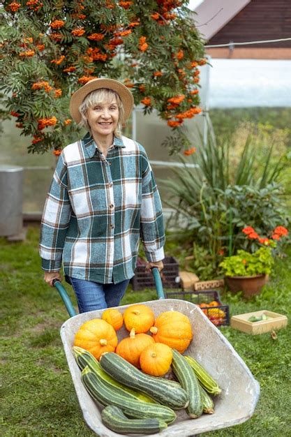 Premium Photo Friendly Woman Harvesting Fresh Vegetables From Her