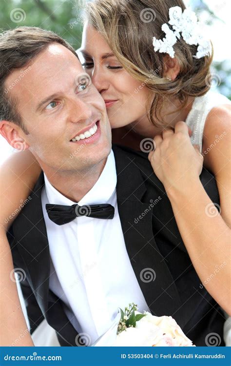 Bride Kissing Her Groom Stock Photo Image Of Pickaback 53503404