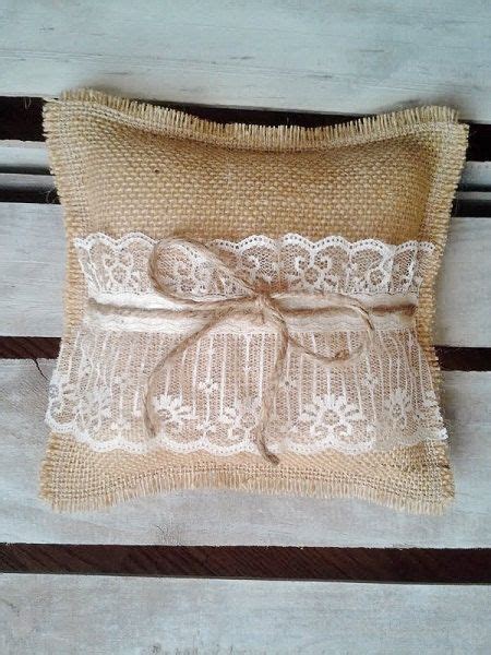 A Decorative Pillow Made Out Of Burlock And Lace