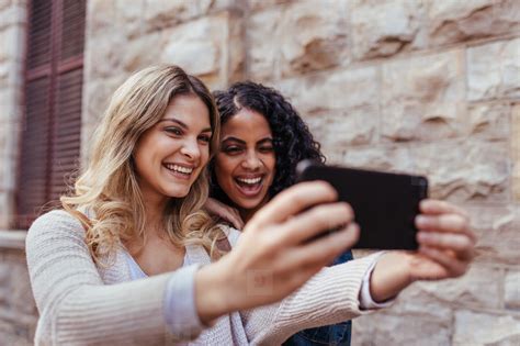 Two Women Clicking A Selfie Outdoors Photo 132145 Youworkforthem