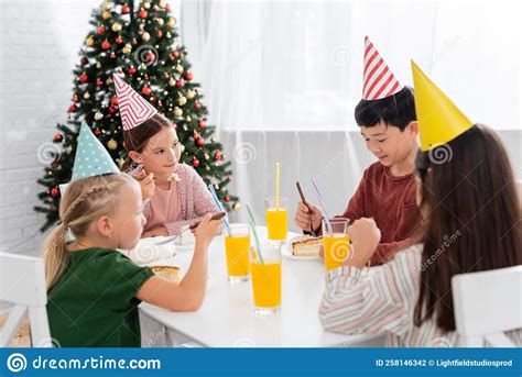 Multiethnic Kids in Party Caps Celebrating Stock Photo - Image of ...