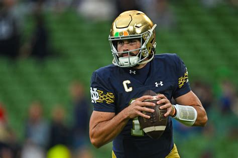 Notre Dame QB Sam Hartman is wearing a necklace with part of his ...