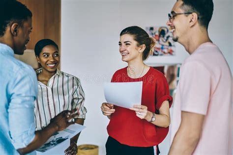 Pleased Diverse Business Partners Brainstorming In Office Stock Photo