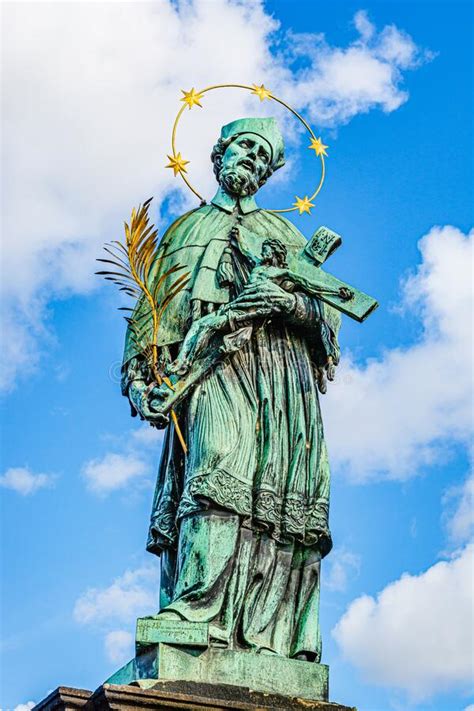 Statue Of Saint John Of Nepomuk On Charles Bridge In Prague Stock Photo