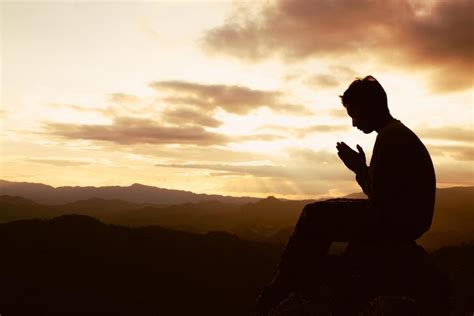 Download silhouette of a man is praying to god on the mountain. praying ...