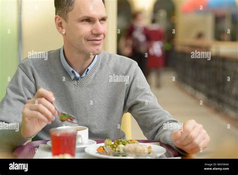 Man Eating His Dinner In A Restaurant Stock Photo Alamy