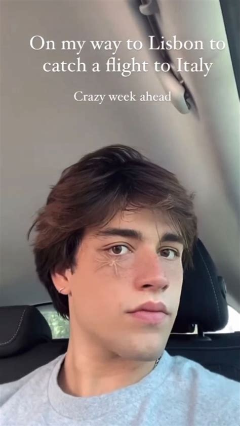 A Man Sitting In The Back Seat Of A Car With A Quote On His Face