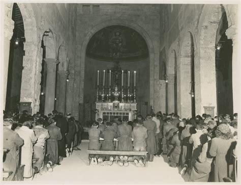 Italian Civilians And British And American Soldiers During A Midnight Mass On Christmas Eve In