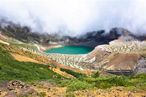 mount zaos okama crater shrouded  cloudsfree stock photo  japan