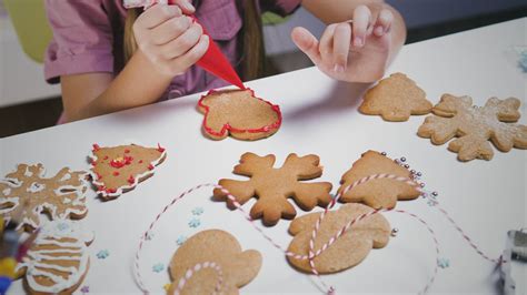 Gingerbread Cookie Being Decorated With Red Icing Free Stock Video